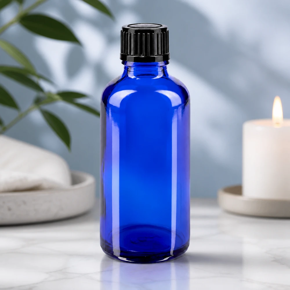 Hochwertige 50ml Rundflasche aus blauem UV-Schutzglas mit schwarzem Dosierverschluss