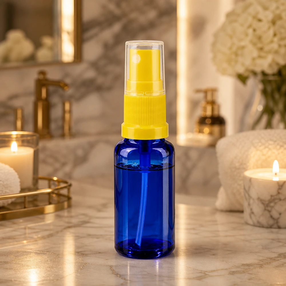 Lékárenská lahvička modrá 20ml s rozprašovacím uzávěrem žlutá Lichtschutz Blauglasflasche 20ml mit gelbem Zerstäuber für Serum und Toner
