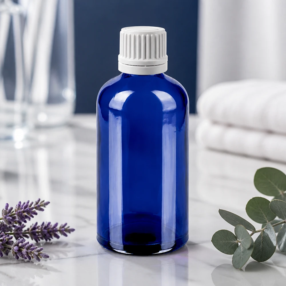 Nachhaltige Tropfflasche 100ml aus recycelbarem blauen Glas mit auslaufsicherem Verschluss
