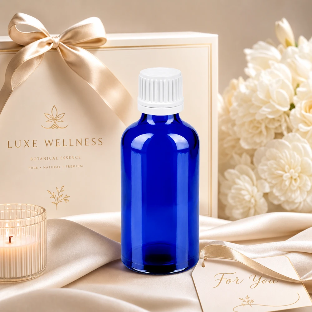 50ml láhev 11mm šroubovací uzávěr bílý uzávěr s ochranou proti manipulaci BlueLine UT18/50 Lichtschützende blaue Glasflasche 50ml mit auslaufsicherem Verschluss für Beauty-Öle