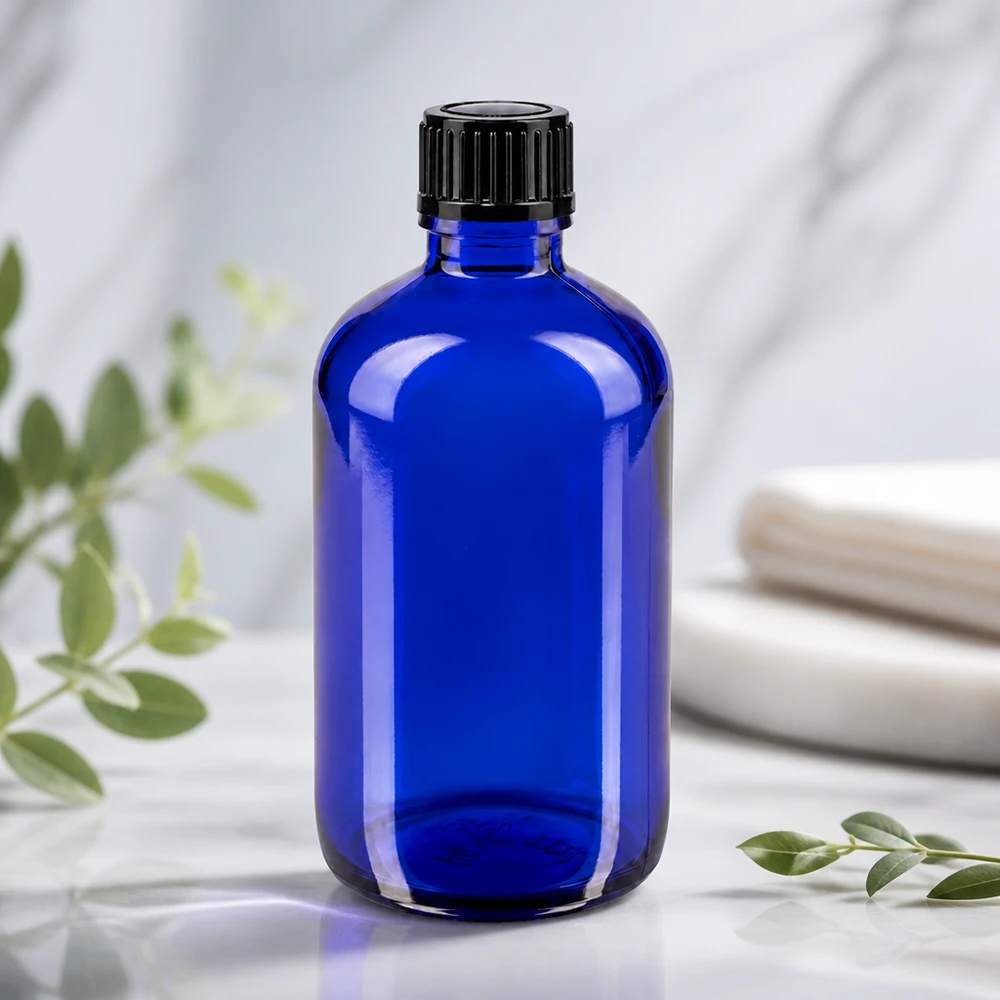 Blaue 100ml Flasche aus Apothekerglas mit schwarzem Schraubdeckel und 1mm Präzisionstropfer