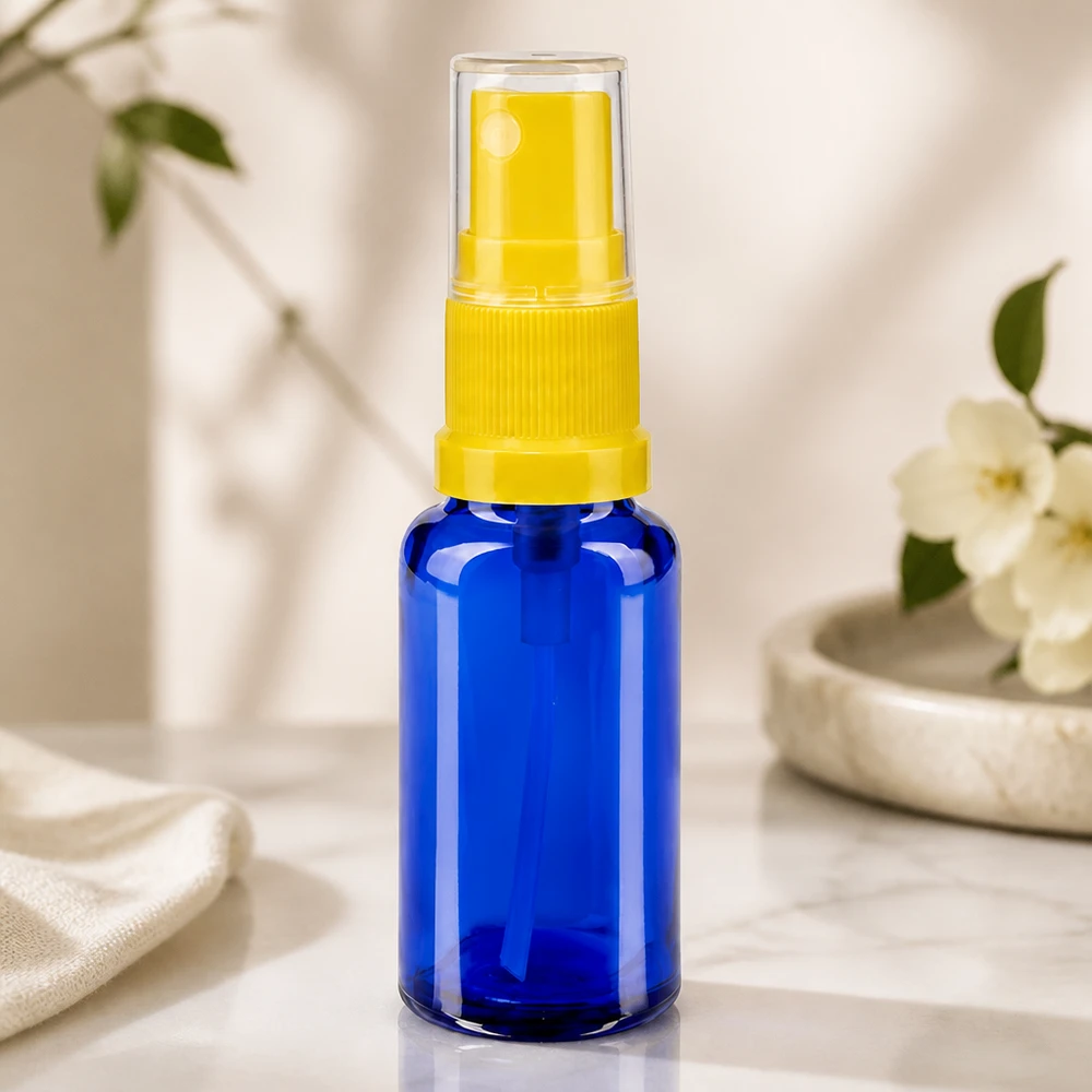Nachfüllbare 20ml Zerstäuberflasche Blauglas gelber Sprühkopf mit Überwurfkappe klar