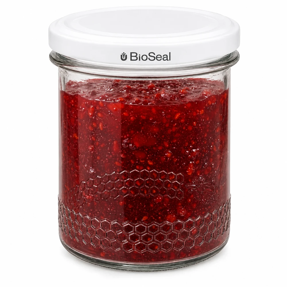 560g Honigglas + BioSeal Deckel weiß UNiTWIST BioSeal Einmachglas 400ml mit roter Marmelade gefüllt zeigt luftdichten Verschluss und Wabenprägung am Glasrand