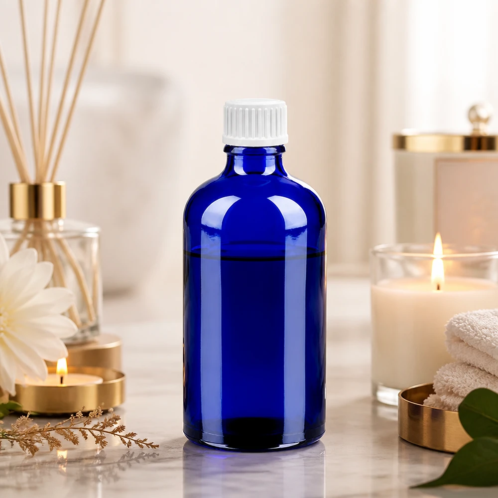 Kompakte 100ml Dosierflasche in Kobaltblau mit ergonomischem weißem Tropfverschluss STD