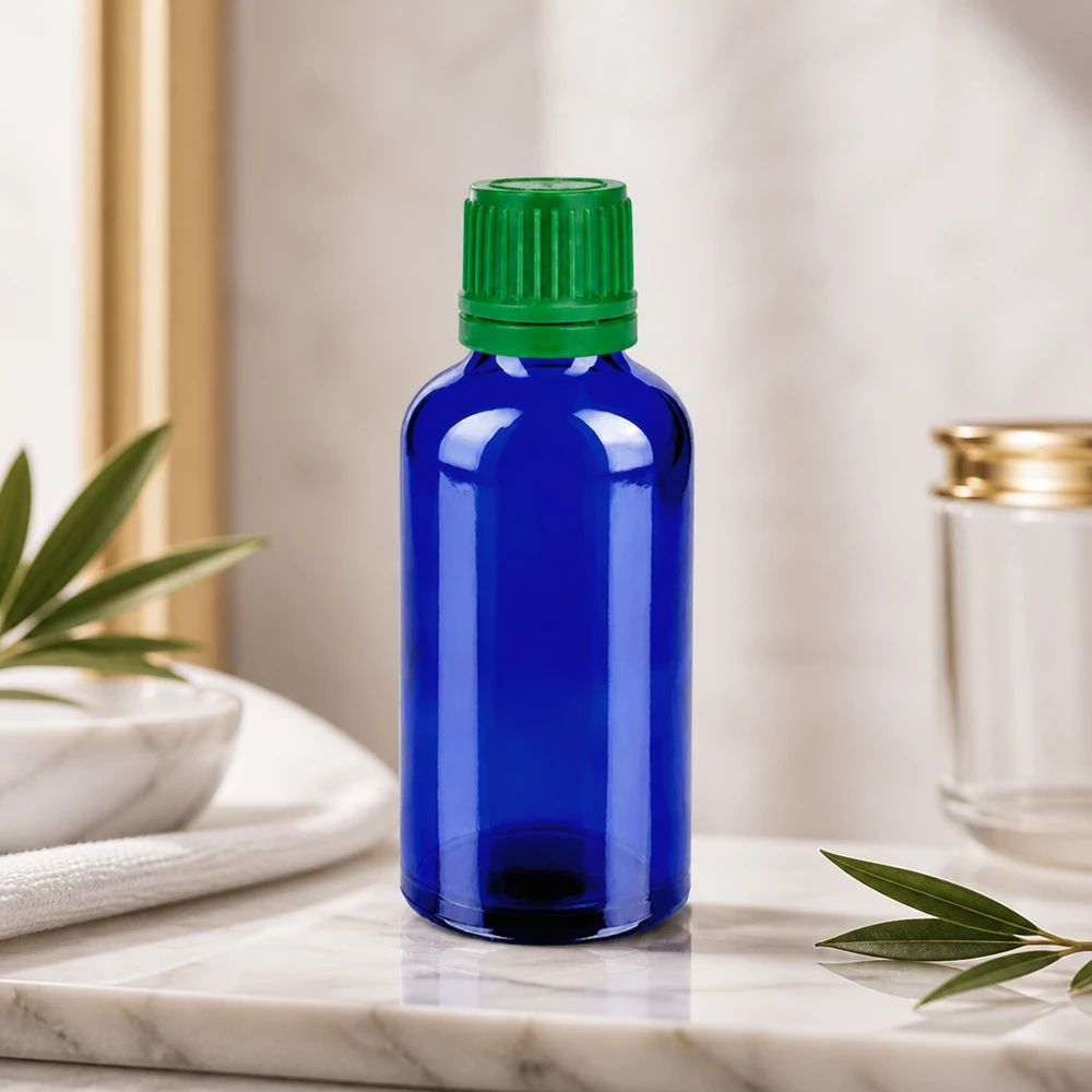 Stilvolle 50ml Kobaltglasflasche mit grünem Deckel für hochwertige Naturkosmetik und Öle