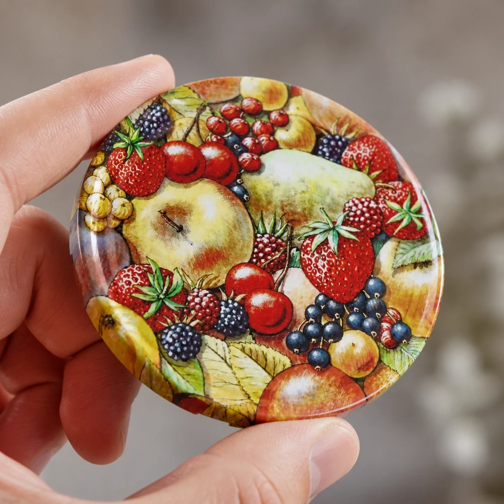 Detailní ilustrace ovoce na kulatém víčku na zavařovací sklenice BasicSeal TO82 UNiTWIST o průměru 82 mm