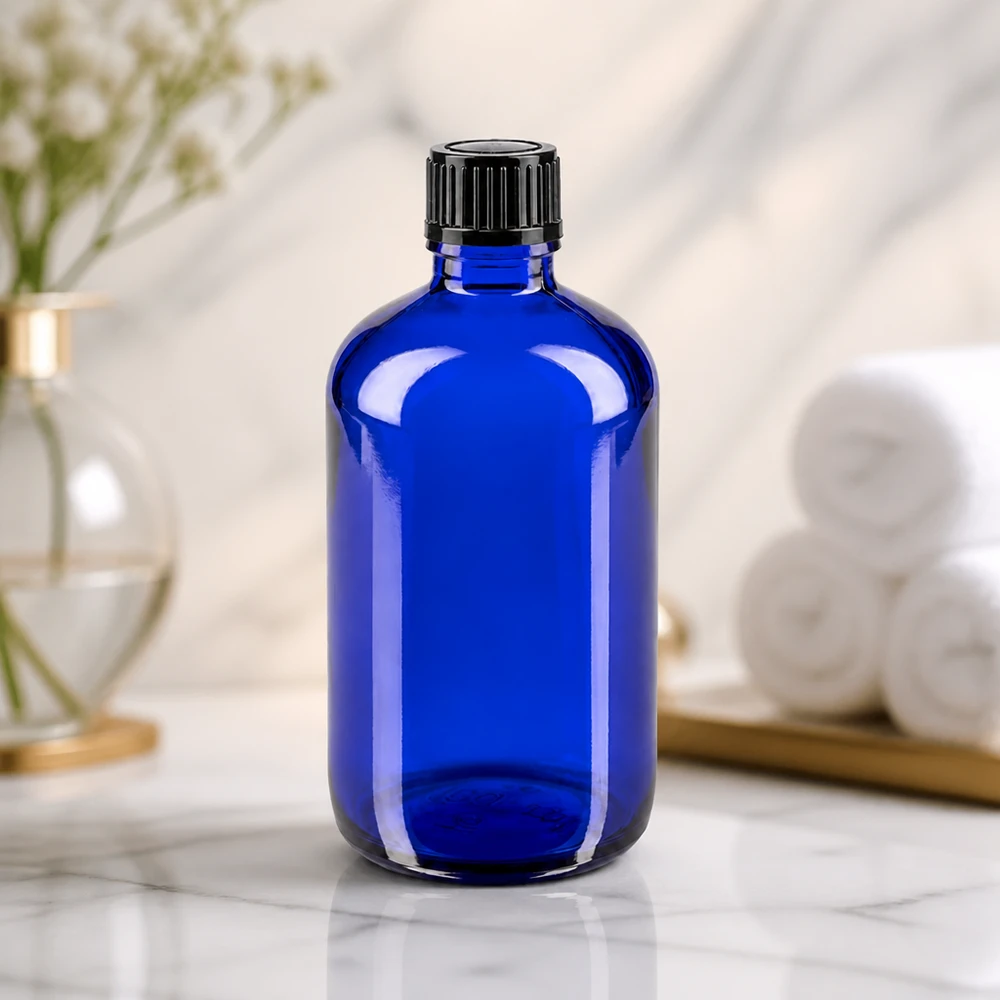 Robuste Apothekerflasche in Kobaltblau 100ml mit kindersicherem schwarzem Schraubverschluss 11mm