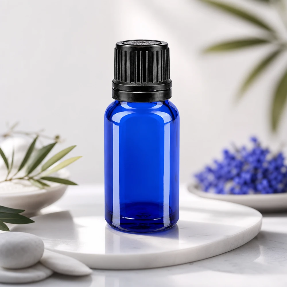 Lékárenská lahvička modrá 10ml kapací uzávěr nalévací kroužek 1mm černý uzávěr proti neoprávněné manipulaci. Lichtschutzflasche 10ml Blauglas mit schwarzem OV-Deckel ideal für Serum und ätherische Extrakte