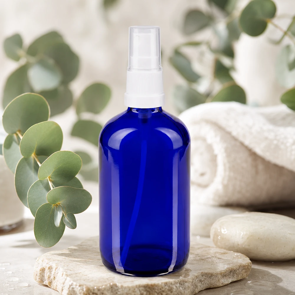 Pharmazeutische 100ml Sprühflasche aus blauem Apothekerglas mit transparentem Pumpaufsatz