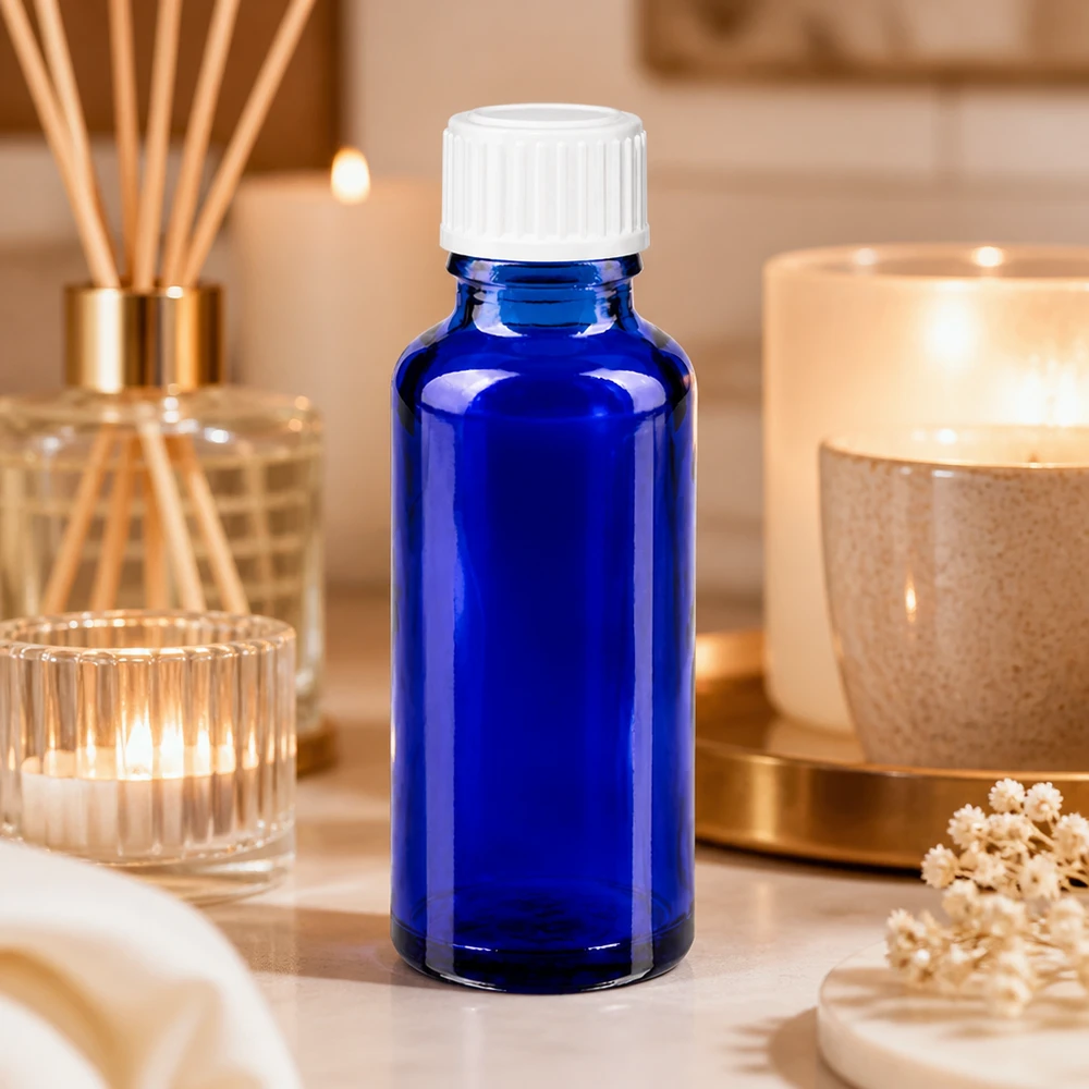 Lékárenská lahvička modrá 30ml šroubovací uzávěr bílá standardní Elegante blaue Glasflasche 30ml mit UV-Schutz und weißem 11mm Verschluss für Öle