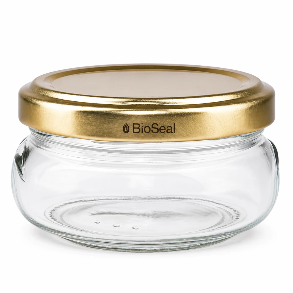Dóza na terinu o objemu 120 ml se zlatým víčkem UNiTWIST BioSeal. Dóza na terinu o objemu 120 ml se zlatým víčkem UNiTWIST BioSeal.