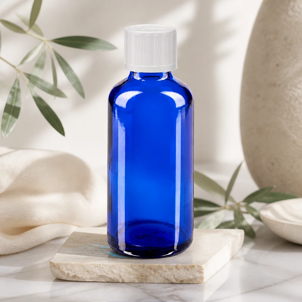Blickdichte kobaltblaue Glasflasche 50ml mit weißem Kindersicherheitsdeckel und Tropfeinsatz
